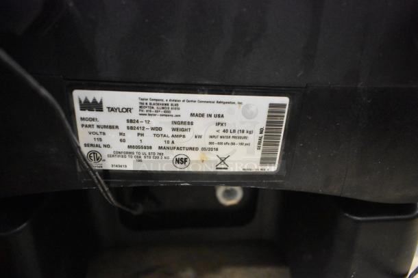 Taylor SB24-12 stainless steel drink blender, 115V, commercial use, serial M6055938, label details 40 lb weight, NSF certified.