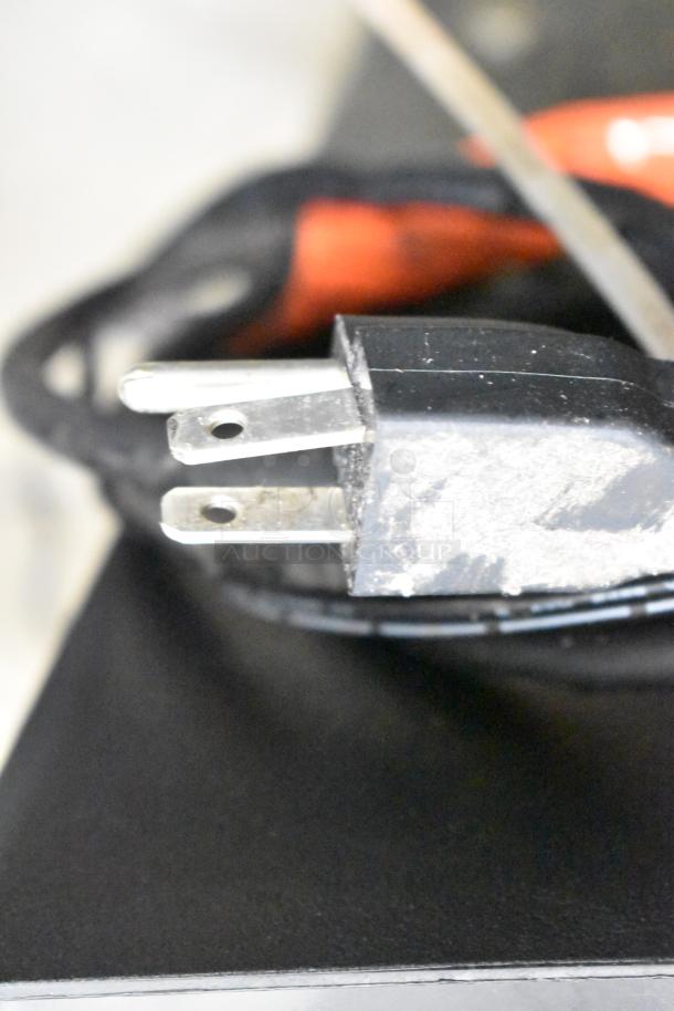 Close-up of a two-prong power plug attached to the Taylor SB24-12 blending machine, showing its 115-volt compatibility.