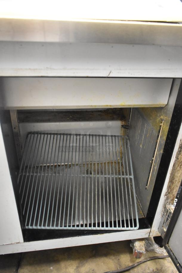 2017 Leader ESLM48S/C commercial sandwich salad prep table with bain marie top. Visible use signs, on commercial casters. 115V, 1 phase.