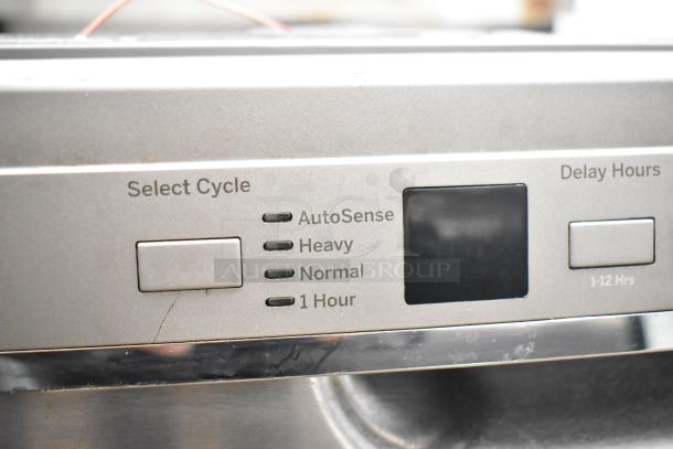 General Electric GE undercounter dishwasher control panel with cycle options: AutoSense, Heavy, Normal, 1 Hour; Delay Hours button.