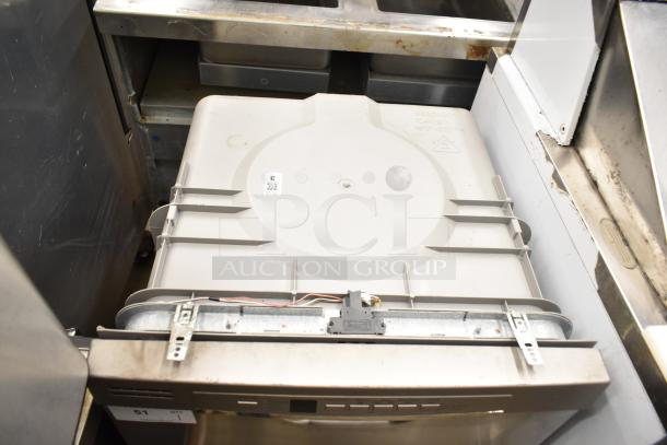 General Electric GE undercounter dishwasher, 115 volts, 1 phase, showing top panel and controls, needs visible cleaning.