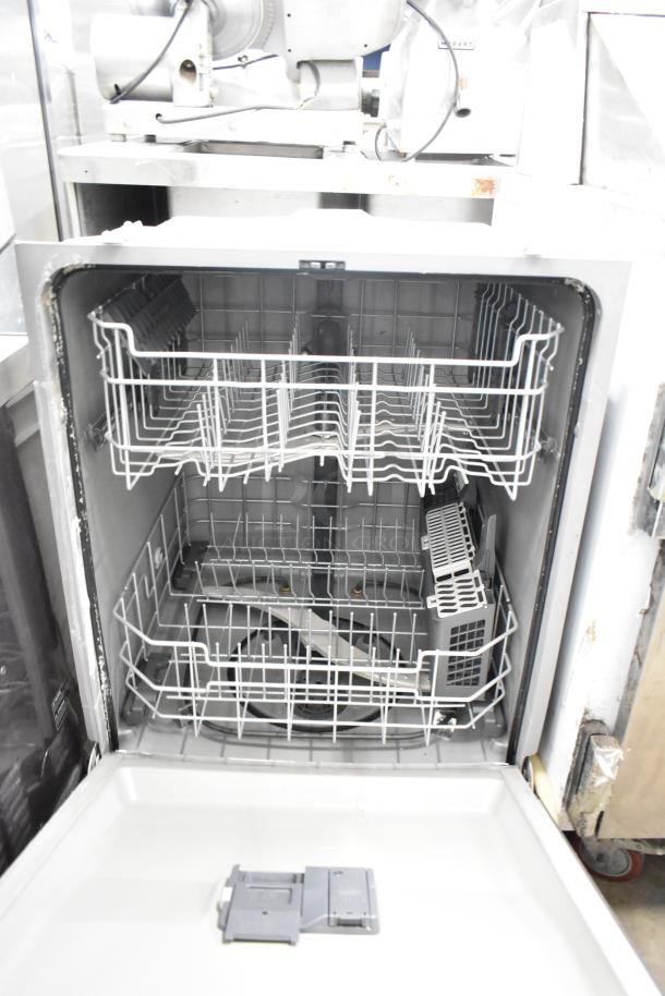 General Electric GE undercounter dishwasher with two racks open, 115 volts, 1 phase. Clean interior, visible control panel.