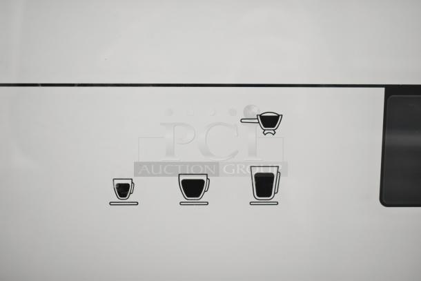 Schaerer Barista 2 Group Espresso Machine control panel with icons for cup sizes and portafilter.