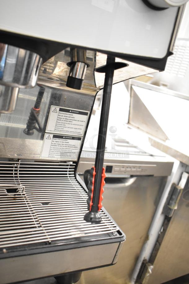 Schaerer Barista espresso machine with 5 portafilters, steam wands, and visible safety labels, in good condition.