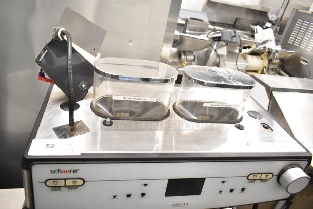 Schaerer Barista automatic espresso machine with 2 groups, 5 portafilters, steam wands; features include regular espresso hoppers.