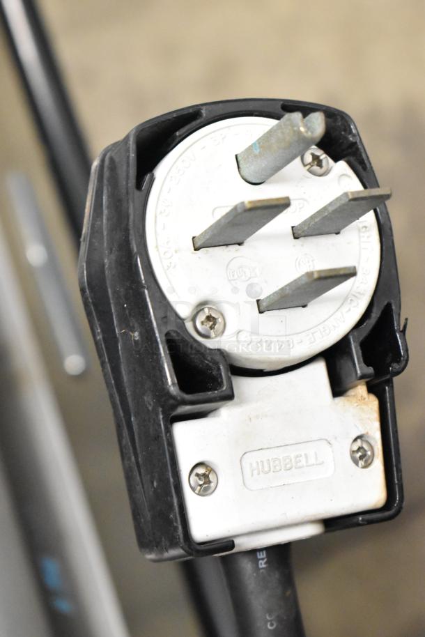 Close-up of a Hubbell electrical plug for a Turbochef I5-DL rapid cook oven, 208/240 volts, 1/3 phase.