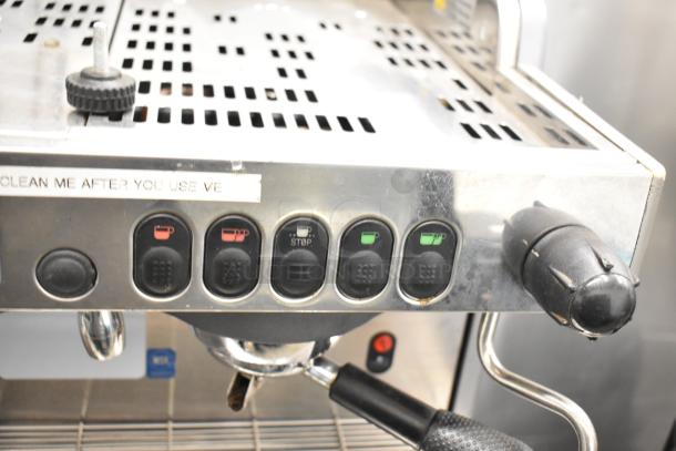 La Cimbali M29 Select 2 Group Espresso Machine, stainless steel finish, 2 portafilters, 2 steam wands, control panel close-up.