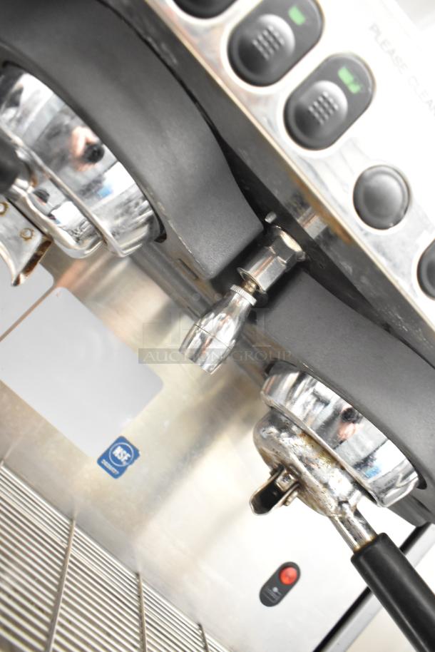 La Cimbali M29 Select Espresso Machine, 2 group heads, 2 portafilters, 2 steam wands, shows some wear, NSF certified.