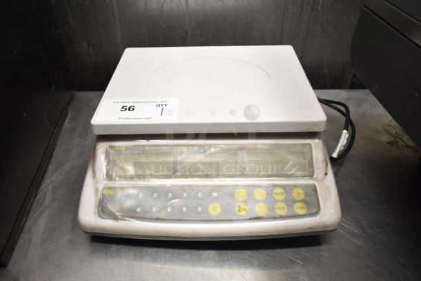 Easy Weigh CK-30 countertop scale, used condition, 110 volts, 1 phase, keypad with yellow buttons, auction tag visible.