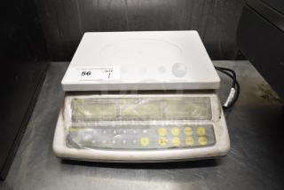 Easy Weigh CK-30 countertop scale, used condition, 110 volts, 1 phase, keypad with yellow buttons, auction tag visible.