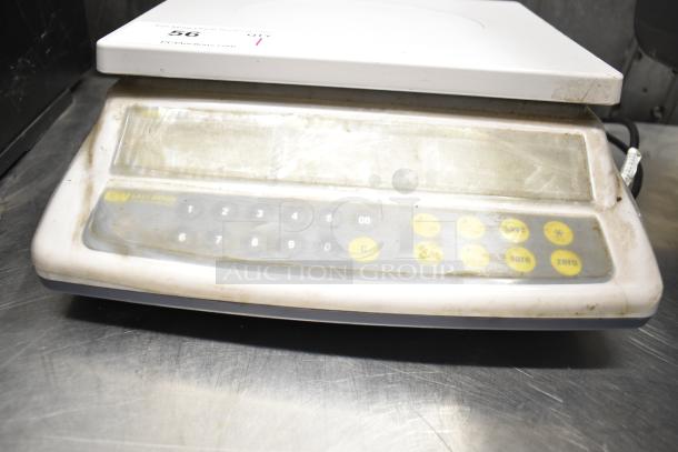 Easy Weigh CK-30 countertop scale, 110 volts, 1 phase. Worn keypad, visible brand logo. Used condition.