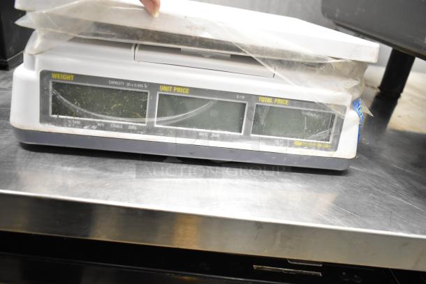 Easy Weigh CK-30 countertop scale, used condition, visible marks. Capacity: 30 lbs. 110 Volts, 1 Phase. Model CK-30.