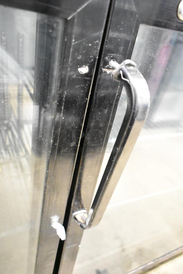 Omcan UBB-24-60G commercial 2-door back bar cooler in black finish, showing glass door and handle. 115V, 1-phase.