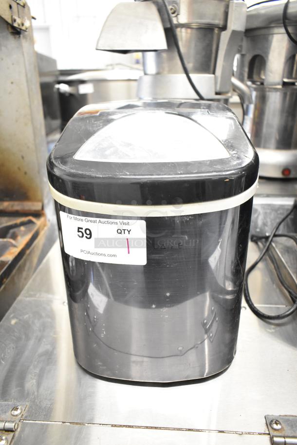 Frigidaire EFIC117-SSBLACK countertop ice machine, black finish, 115 volts, 1 phase, visible auction label, good condition.