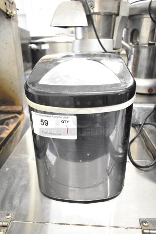 Frigidaire EFIC117-SSBLACK countertop ice machine, black finish, 115 volts, 1 phase, visible auction label, good condition.