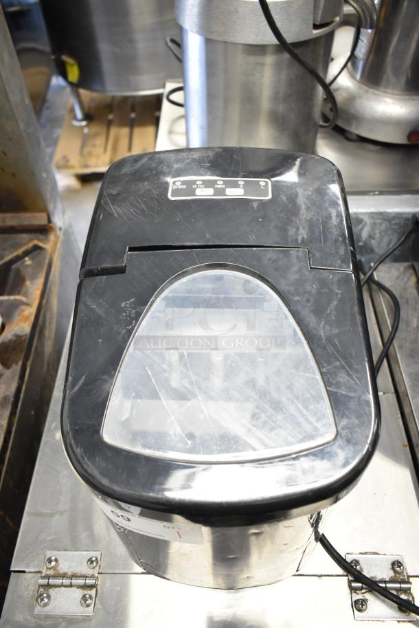 Frigidaire EFIC117-SSBLACK countertop ice machine, 115V, 1 phase, black top, stainless steel body, minor surface scratches.