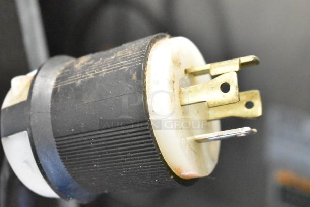 Close-up of a power plug for Bunn IMIX-5 Commercial Countertop Cappuccino Machine, showing minor wear.