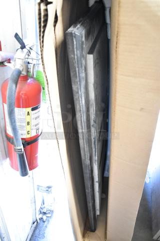 Two Samsung 50" Smart Signage LED displays in packaging, ready for auction. Condition: See image for specifics.