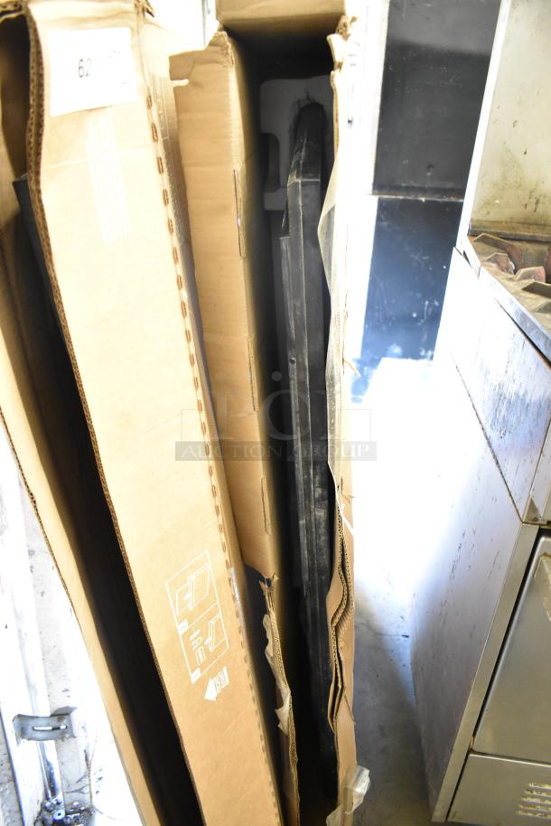 Two Samsung 50" Smart Signage LED Displays in original packaging. Boxes show open condition. Ideal for digital signage.