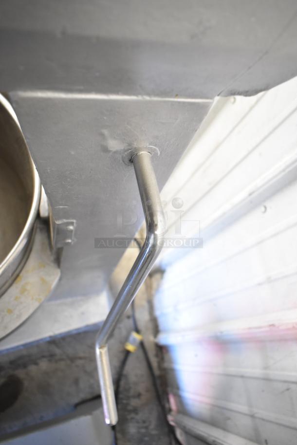 Commercial planetary dough mixer with stainless steel mixing bowl and bowl guard, in good condition.