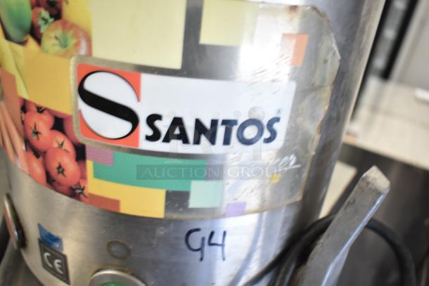 Santos commercial countertop juicer, 115 volts, 1 phase. Features vibrant produce design and visible "G4" marking.