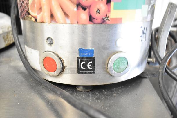 Santos Commercial Countertop Juicer, 115 Volts, 1 Phase. Features CE marking. Some wear visible on exterior.