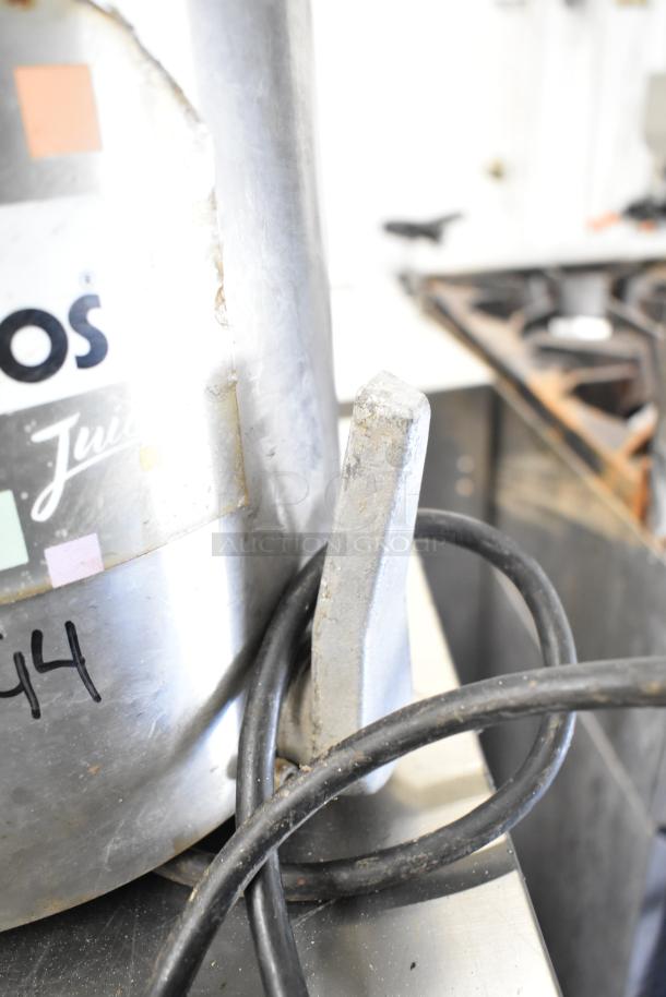 Santos Commercial Countertop Juicer, 115V, 1 Phase, visible wear with power cord, partially visible label.