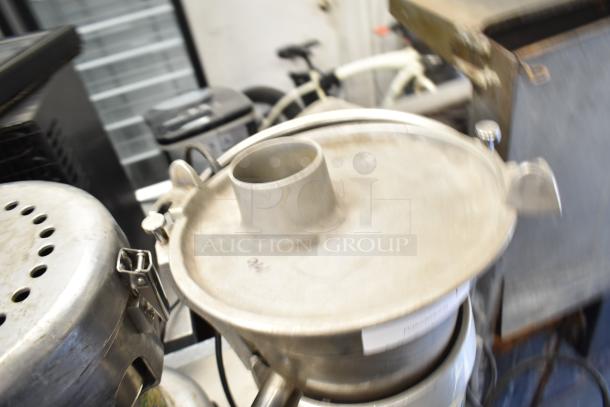 Santos Commercial Countertop Juicer, 115 volts, 1 phase, stainless steel, sturdy lid clasp, suitable for high-volume juicing.