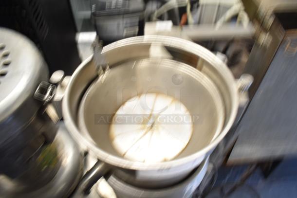 Santos Commercial Countertop Juicer, 115 Volts, 1 Phase, stainless steel, visible signs of use, durable construction.