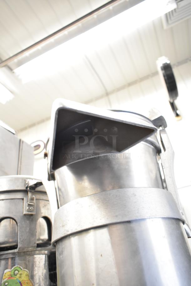 Santos Commercial Countertop Juicer, stainless steel, 115 volts, 1 phase, durable design, good condition.