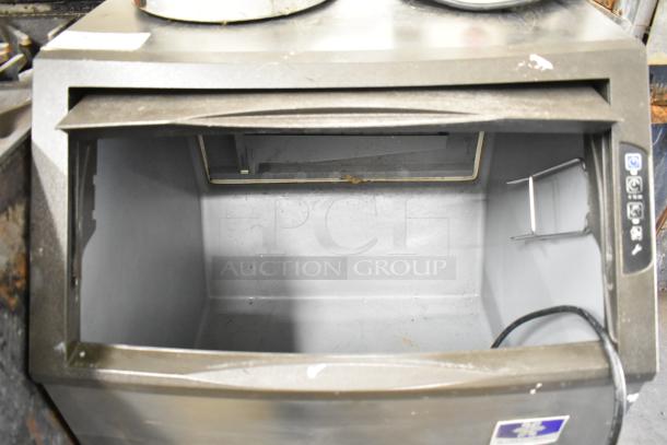 2018 Manitowoc UYF0140A half-dice ice maker with bin, 100-200 lbs/day, cube style, 115V, visible controls, open bin.