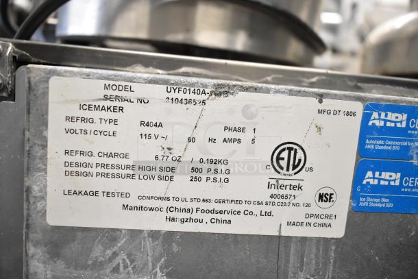 2018 Manitowoc UYF0140A ice maker label showing model, serial number, 115V specs, and certifications.
