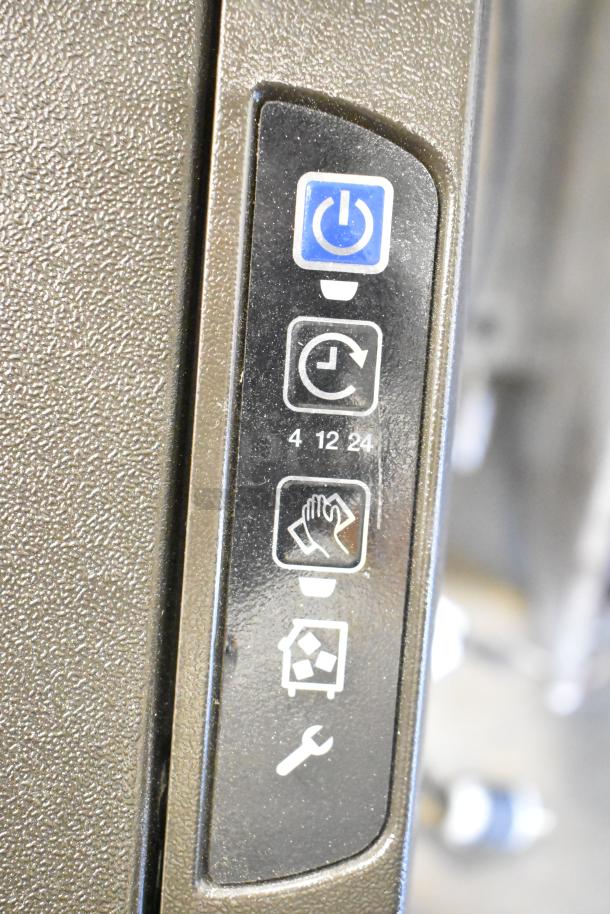 2018 Manitowoc UYF0140A ice maker control panel close-up showing power, timer, cleaning, and maintenance icons.