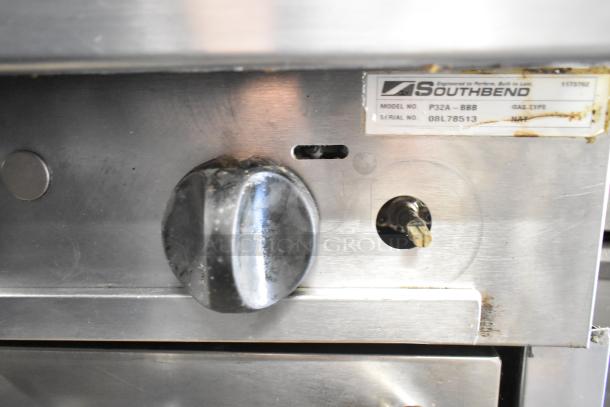 Southbend P32A-BBB commercial range control panel with model label, natural gas type, and serial number visible.
