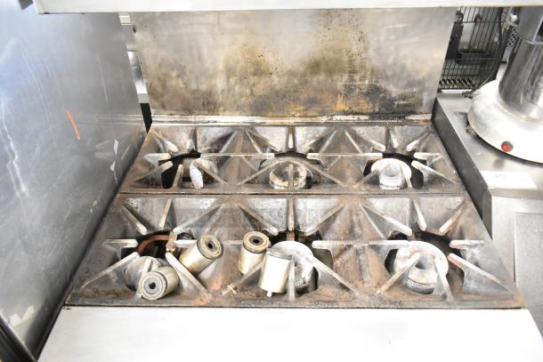 Southbend P32A-BBB 6-burner commercial gas range with convection oven, salamander cheese melter, and backsplash. Used condition.