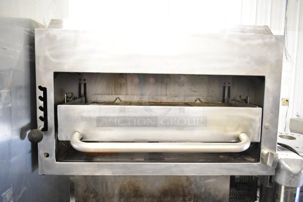 Southbend P32A-BBB Commercial Gas Range with 6 burners, convection oven, and salamander cheese melter. Stainless steel, used condition.