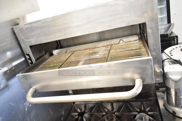 Southbend P32A-BBB commercial 6 burner range with convection oven, salamander cheese melter, and backsplash, in used condition.