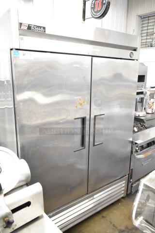 True T-49F Commercial 2 Door Reach-In Freezer, stainless steel, 115 volts, 1 phase, visible wear on doors, model label intact.