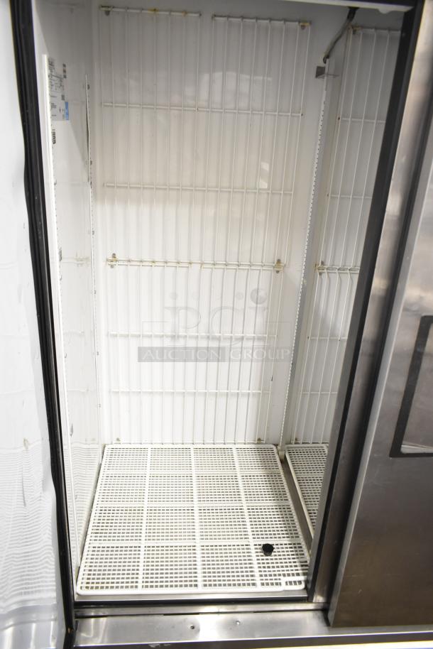 True T-49F commercial 2-door freezer, 115 volts, 1 phase. Durable, spacious shelving, good condition, ideal for restaurants.
