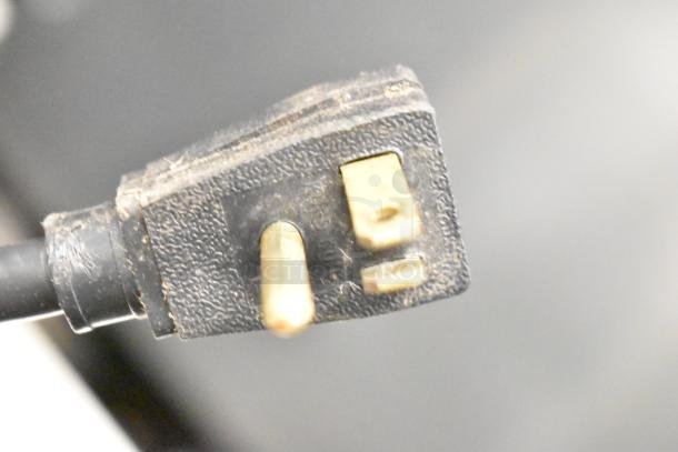 Close-up of the power plug for a True T-49F Commercial 2 Door Reach In Freezer, showing a 115-volt, 1-phase plug.