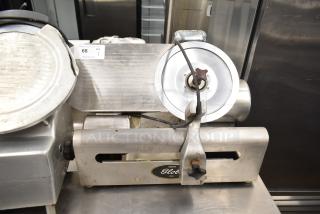 Globe 500 commercial meat slicer, missing carriage, with blade sharpener. 115V, 1 Phase. Stainless finish, visible wear.