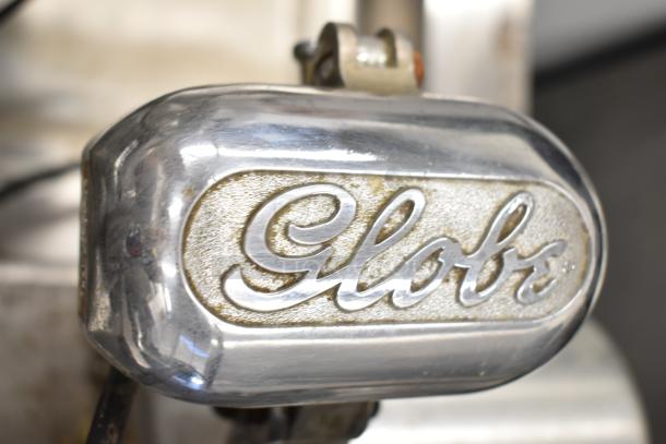 Globe 500 Commercial Meat Slicer, 115V, missing carriage, with blade sharpener, model nameplate visible.