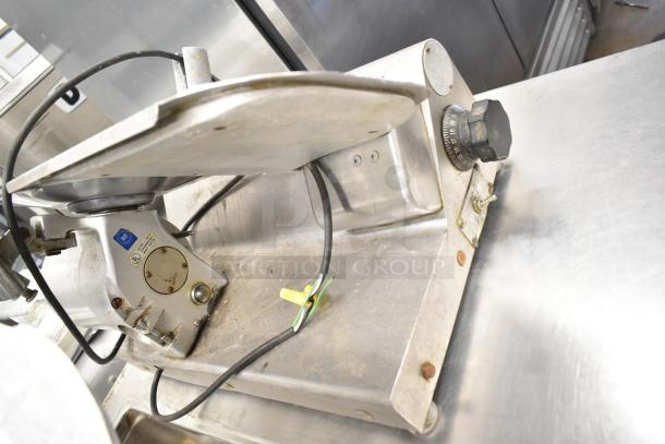 Globe 500 Commercial Meat Slicer, missing carriage, with blade sharpener. Used condition, NSF label visible, 115V, 1 Phase.
