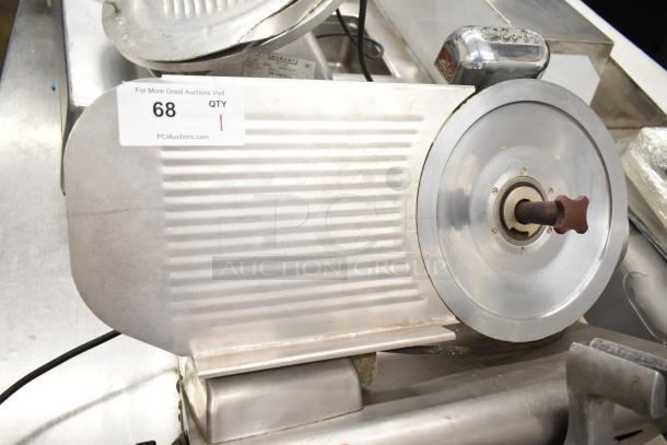 Globe 500 commercial meat slicer with blade sharpener, missing carriage. 115 volts, 1 phase. Auction label visible. 