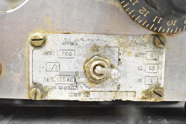 Globe 500 Commercial Meat Slicer label close-up; shows model, power specs (115 volts, 1 phase). Carriage missing.