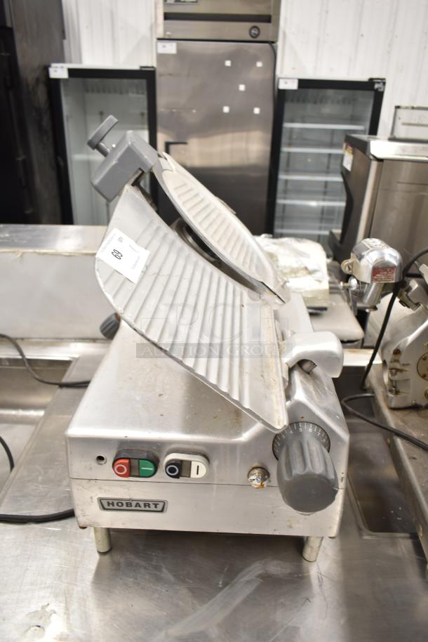 2019 Hobart Edge13A-11 meat slicer, missing carriage and arm. Includes blade sharpener. 115V, 1 Phase. Used condition.