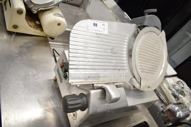 2019 Hobart Edge13A-11 commercial meat slicer with blade sharpener, missing carriage and arm. 115V, 1 Phase.