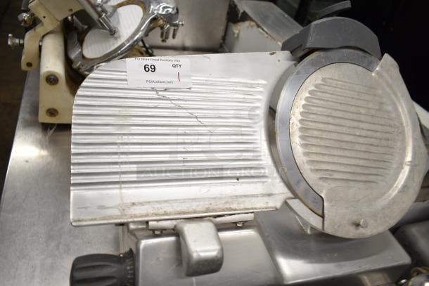 2019 Hobart Edge13A-11 meat slicer, missing carriage and arm. Includes blade sharpener. Visible label: "For More Great Auctions Visit PCI Auctions."