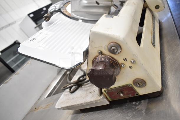 Globe 260 commercial countertop meat slicer with blade sharpener, 115 volts, 1 phase, used condition with visible wear.