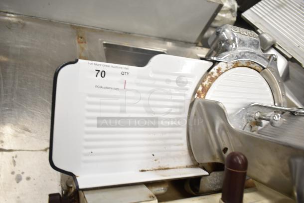Globe 260 Commercial Meat Slicer with blade sharpener, visible use, metal construction, 115V, 1 phase. Label: 70 QTY.